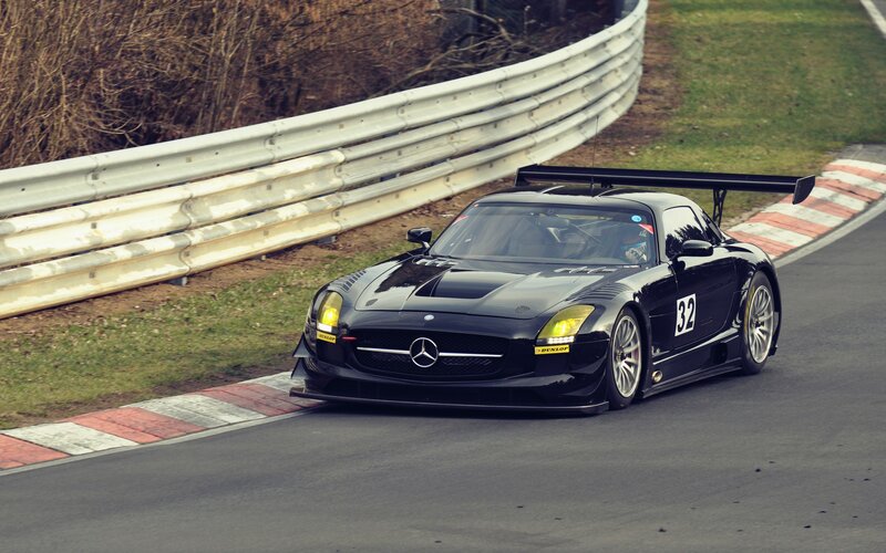 Black Mercedes race car on track