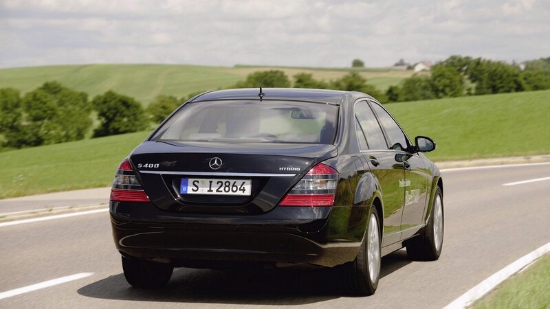 black mercedes s400 hybrid on road