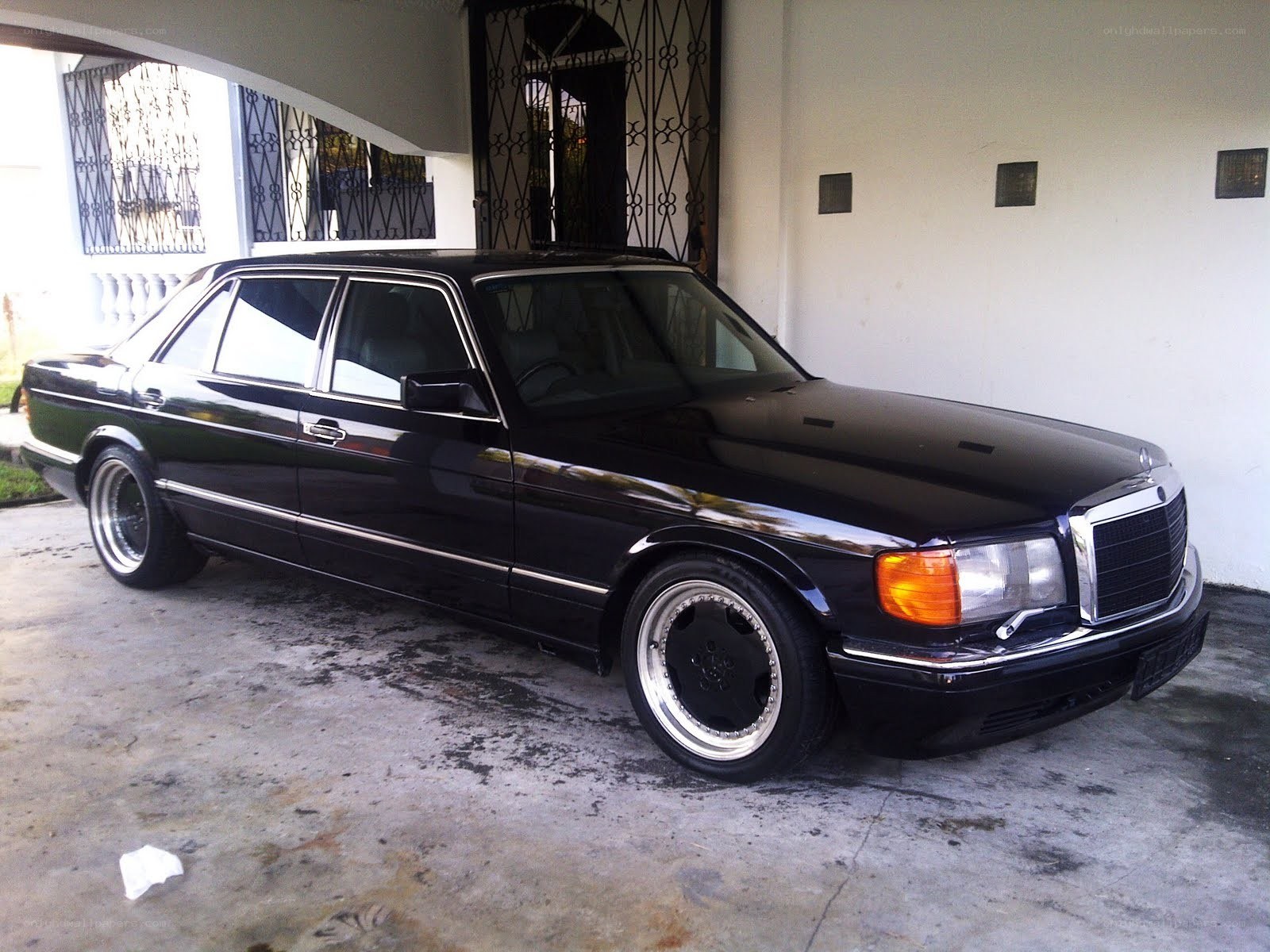 black mercedes sedan parked
