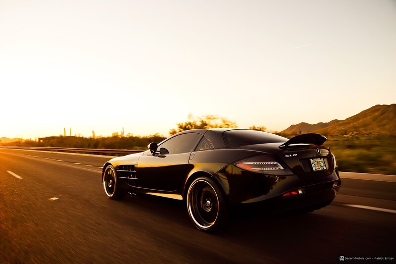 Black Mercedes SLR on desert highway