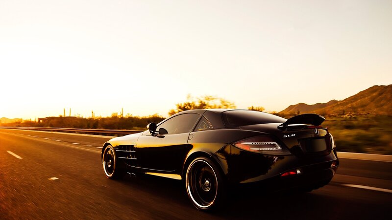 Black Mercedes SLR on desert highway