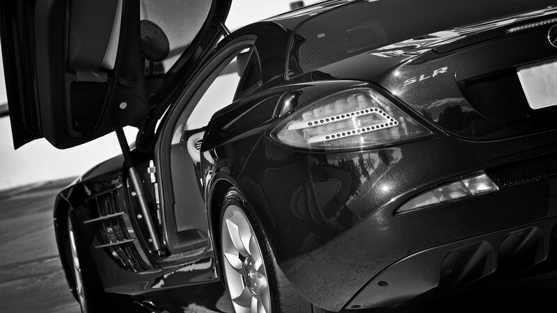 Black Mercedes SLR with open door
