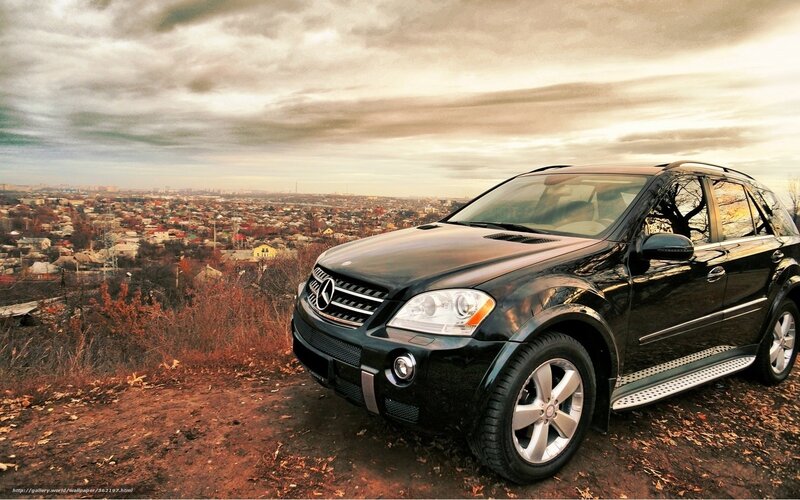 Black Mercedes SUV on a hill
