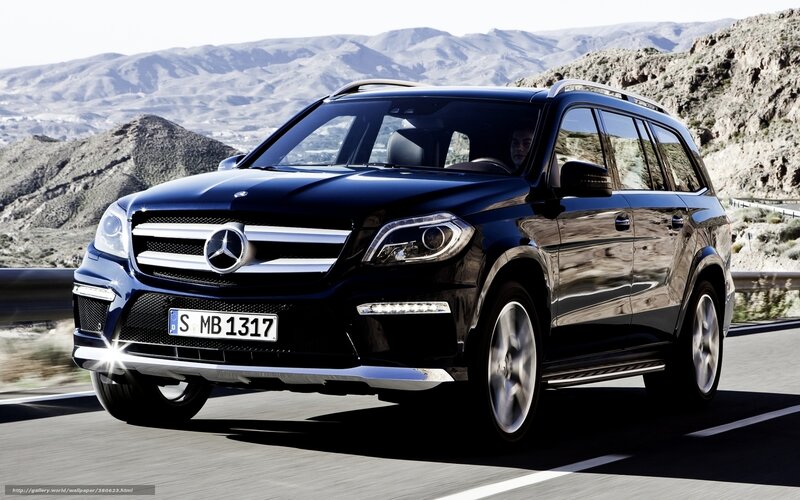 black mercedes suv on mountain road