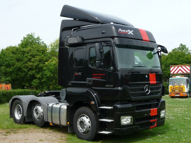 black mercedes truck on grass