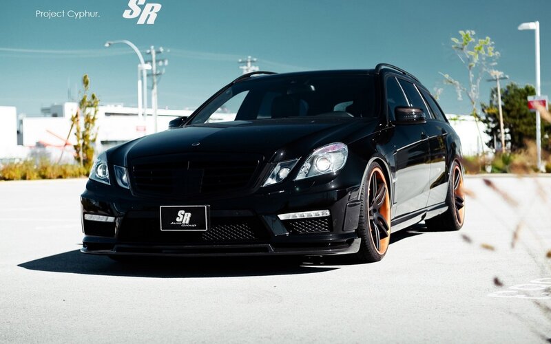 black mercedes wagon with orange wheels