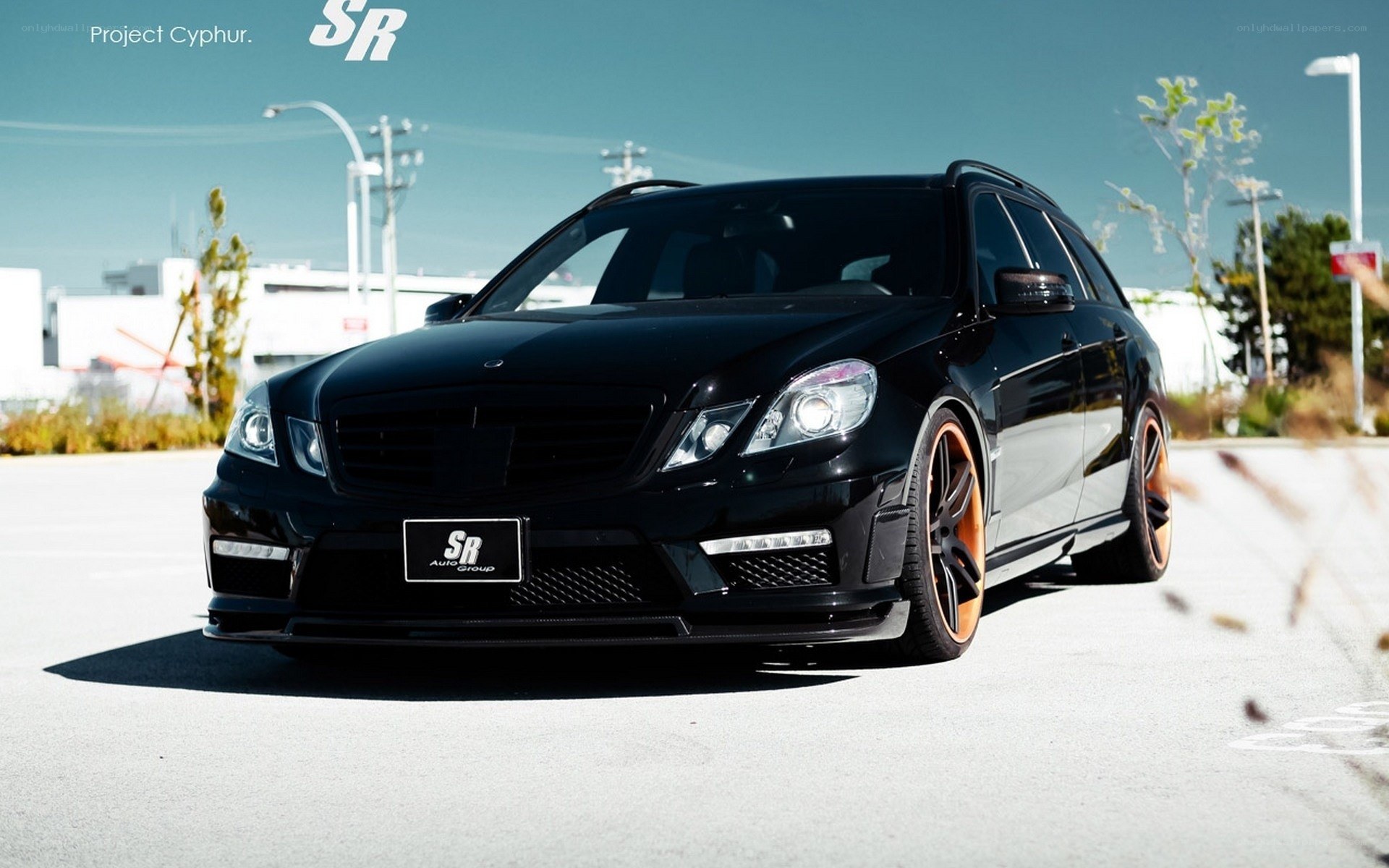 black mercedes wagon with orange wheels