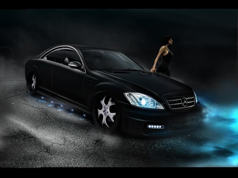 Black Mercedes with woman in dark setting