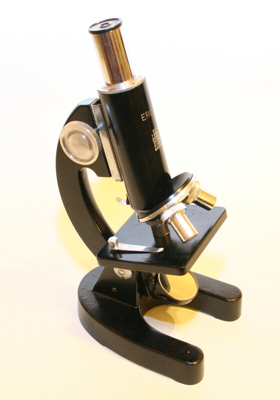black microscope on white
