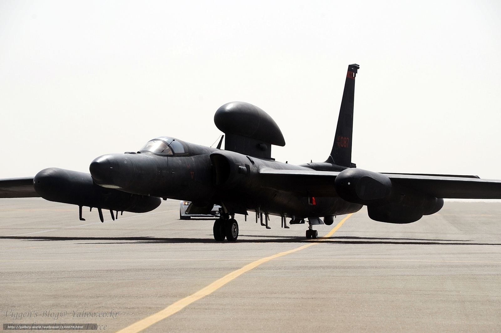 Black military aircraft on tarmac