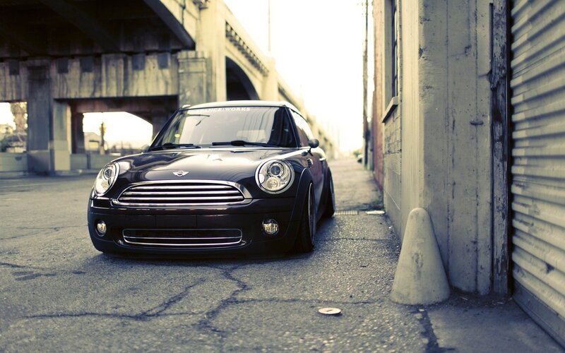 Black Mini Cooper in alley