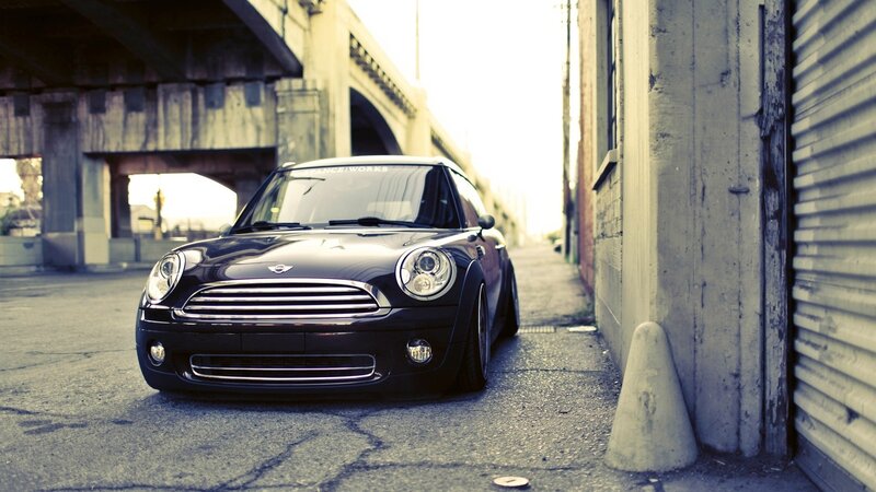 Black Mini Cooper in alley