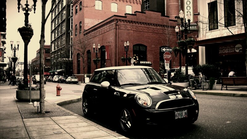 Black Mini Cooper on city street