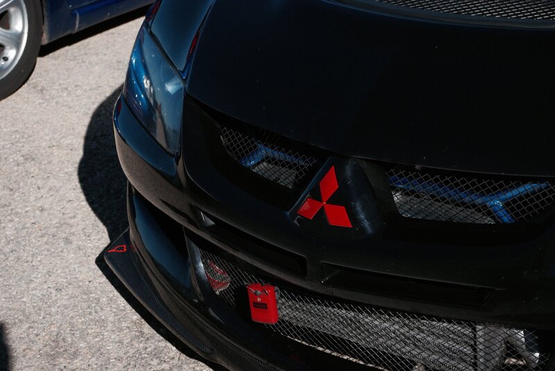 Black Mitsubishi Car — Dramatic