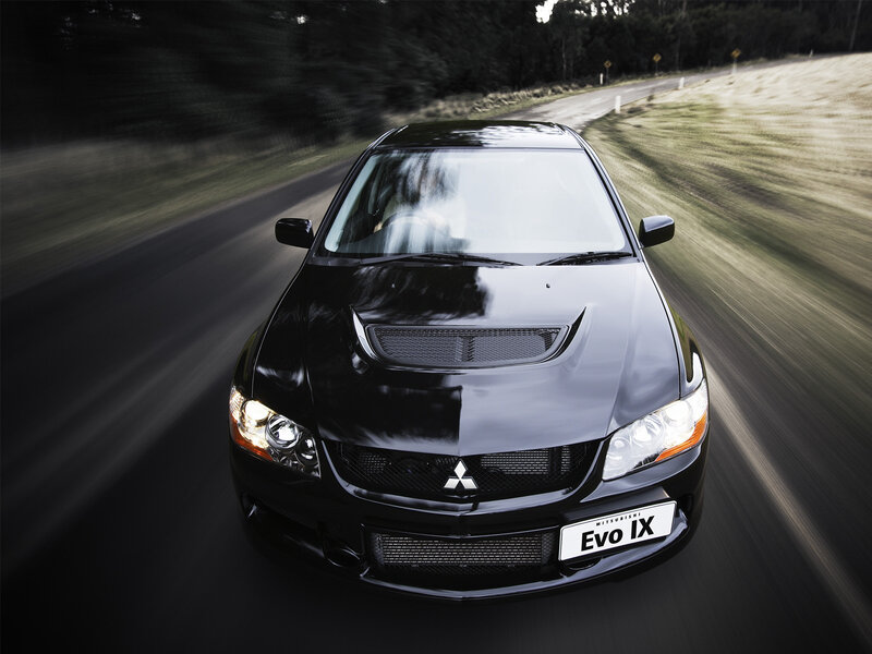 Black Mitsubishi Evo IX on road
