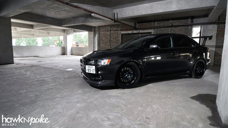 black mitsubishi lancer in garage