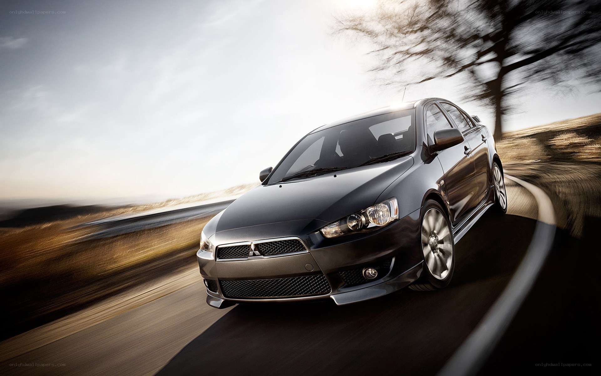 Black Mitsubishi Lancer in motion