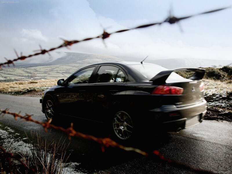 Black Mitsubishi Lancer on a rural road