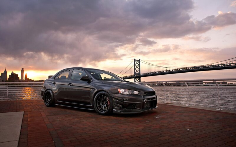 Black Mitsubishi Lancer on waterfront