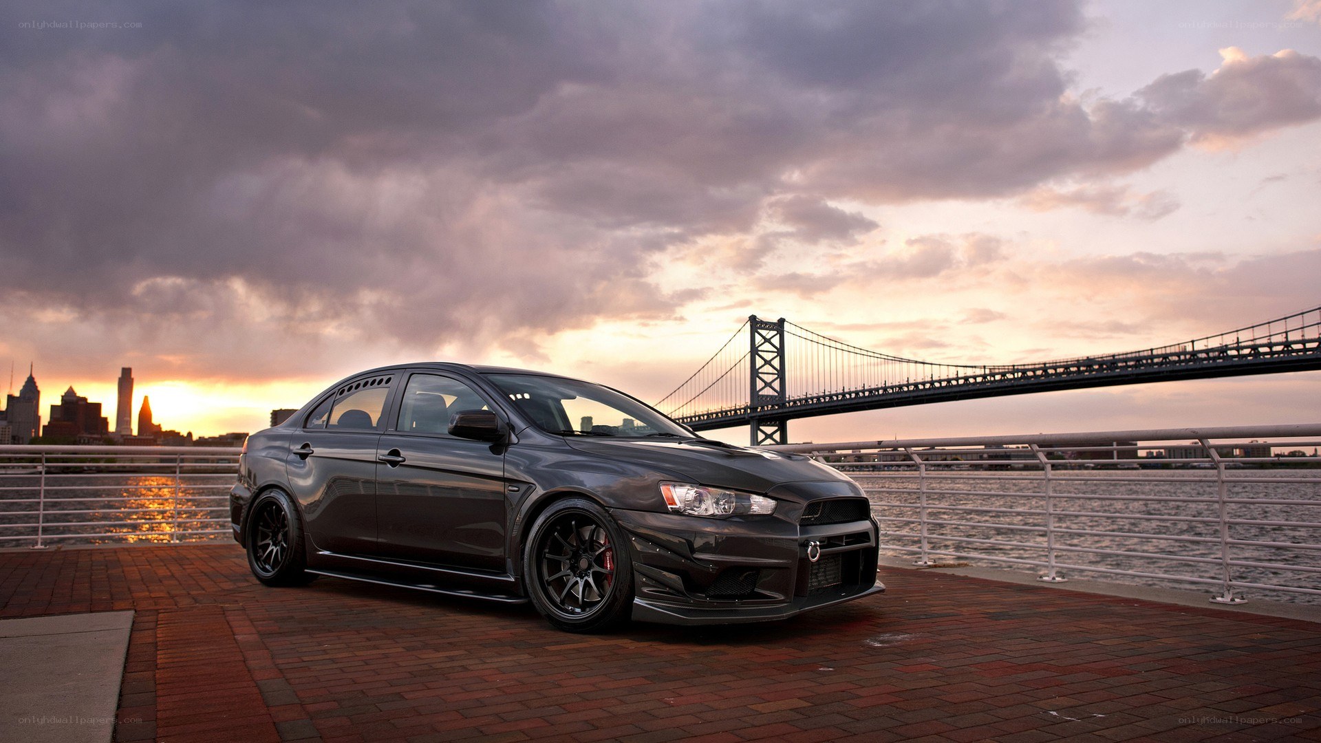 Black Mitsubishi Lancer on waterfront