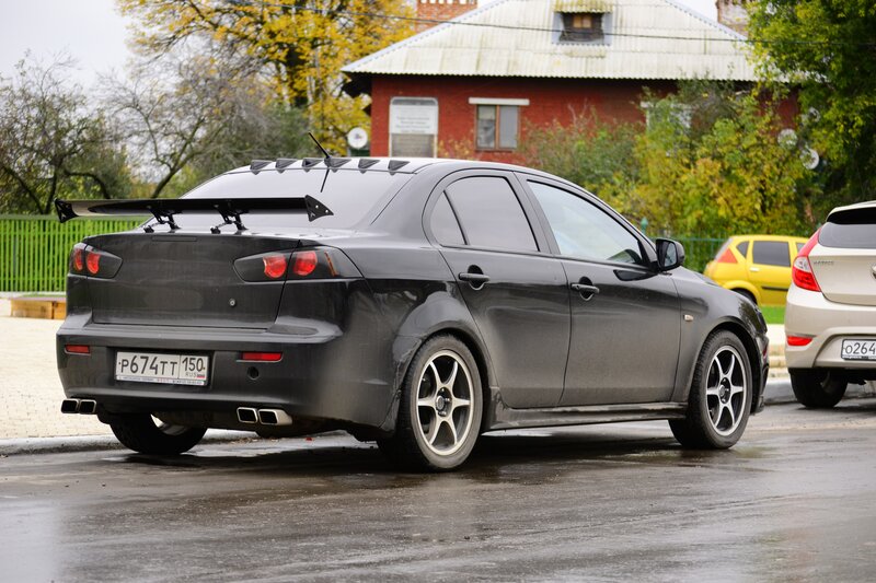 black mitsubishi lancer with rear spoiler