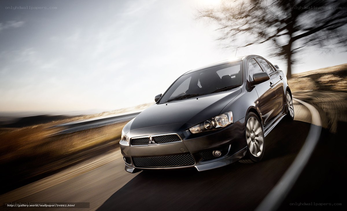 Black Mitsubishi on a winding road