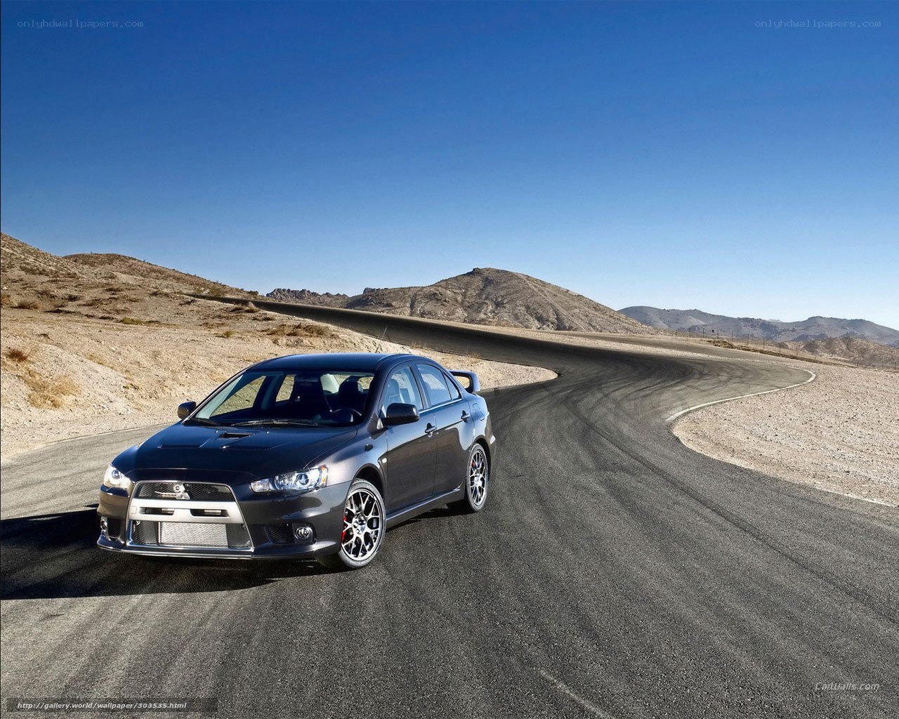 Black Mitsubishi on desert track