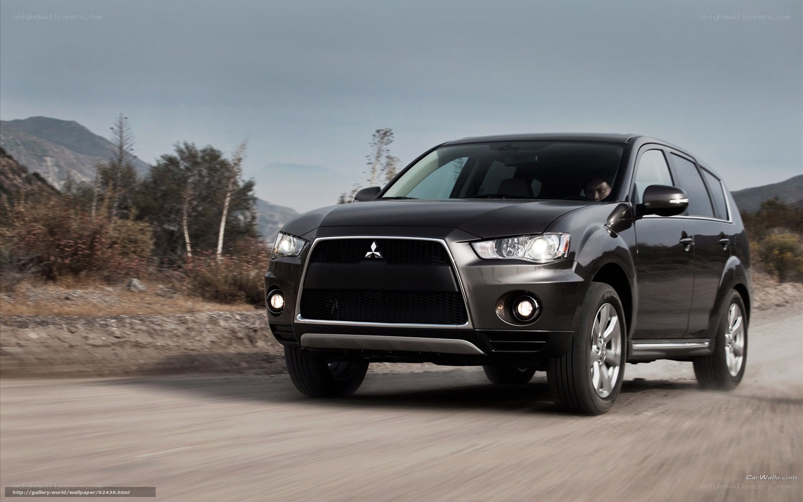 Black Mitsubishi SUV on a road