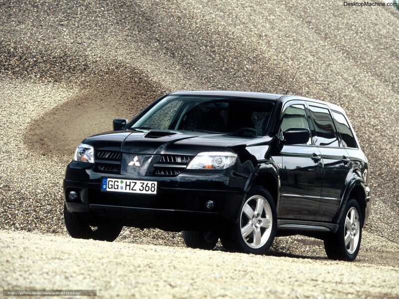 Black Mitsubishi SUV on gravel