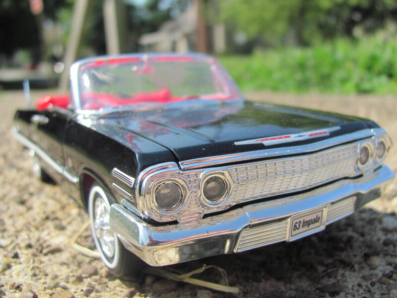 Black Model Car — Calm, Afternoon, Photograph, Gravel