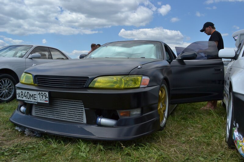 Black modified car at outdoor show