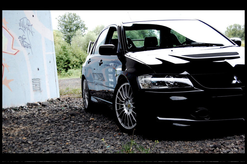 Black Modified Car — Dramatic, Afternoon, Photograph, Graffiti Wall