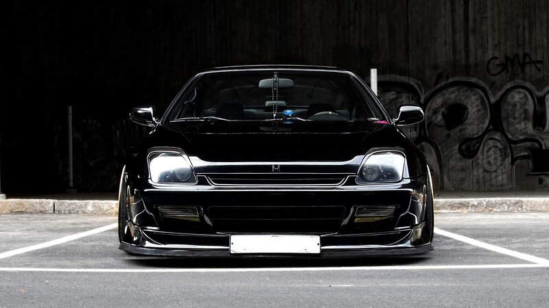Black Modified Car — Dramatic, Photograph, Graffiti Wall