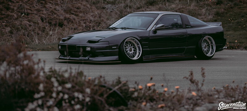 Black Modified Car — Dramatic, Photograph, Road, Plants
