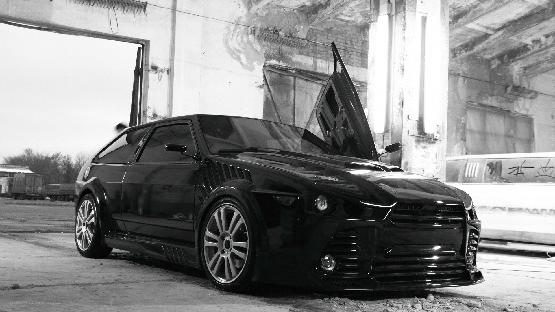 black modified car in garage