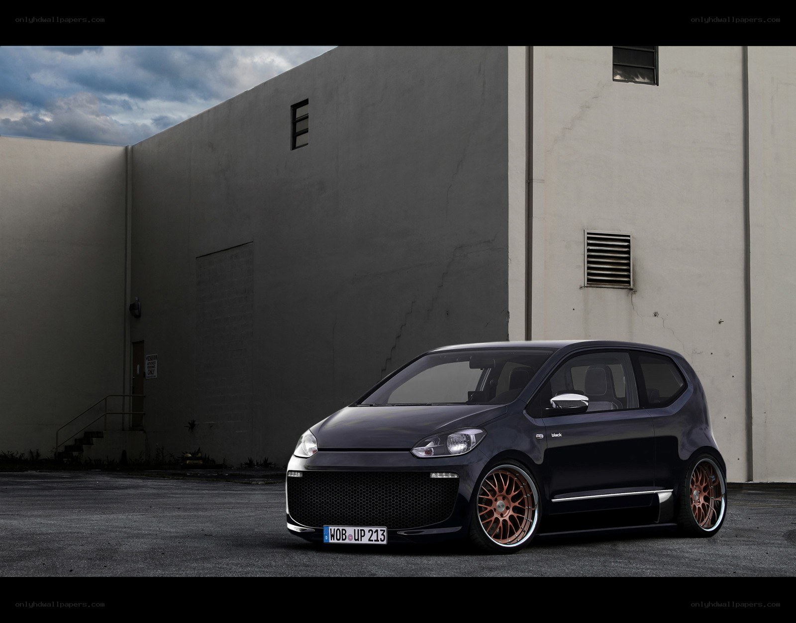 Black modified car in parking lot