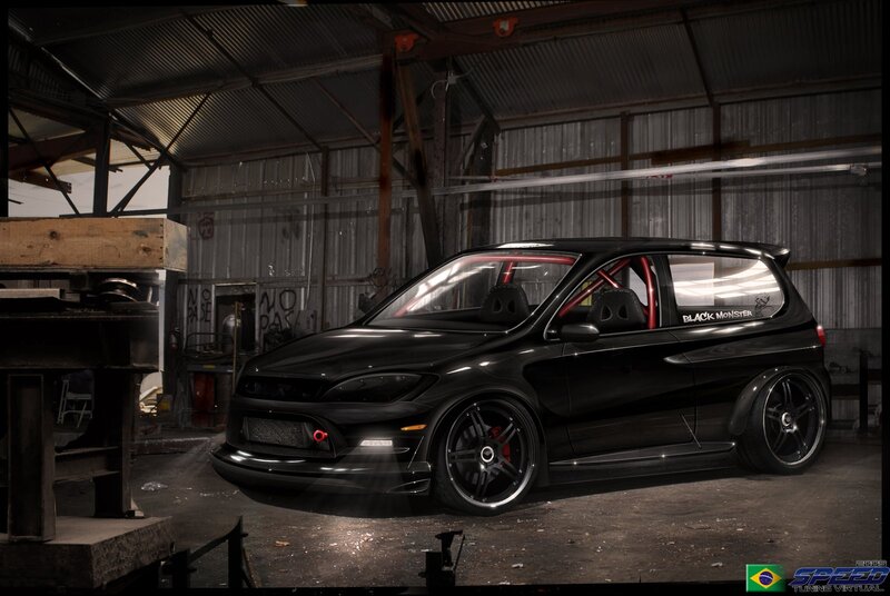 black modified hatchback in garage