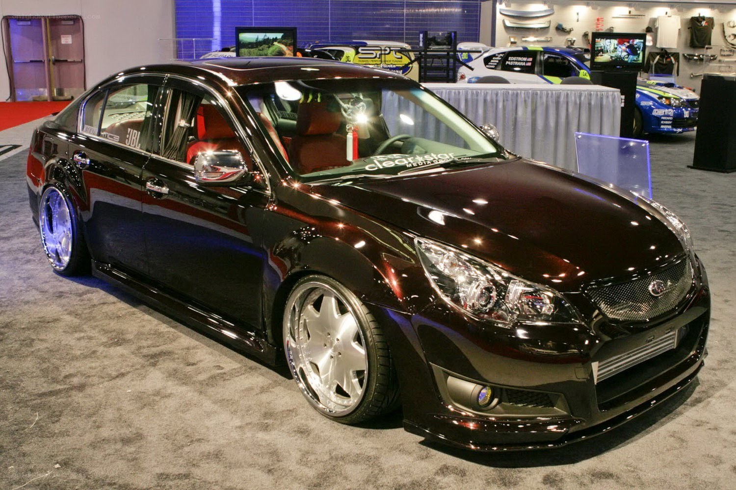 black modified sedan at auto show
