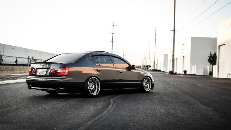 Black Modified Sedan — Calm, Afternoon, Photograph, Building
