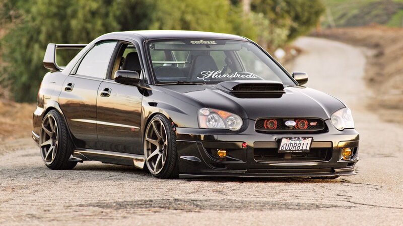 Black Modified Sedan — Calm, Sunset