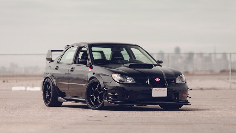 Black Modified Sedan — Dramatic, Afternoon, Photograph, Wings