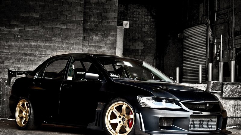 Black Modified Sedan — Dramatic, Night, Photograph, Bricks