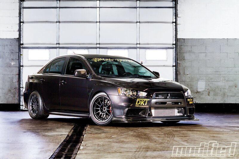 Black Modified Sedan — Dramatic, Photograph, Garage Door