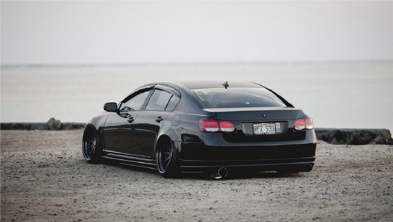 Black Modified Sedan — Serene, Sunset