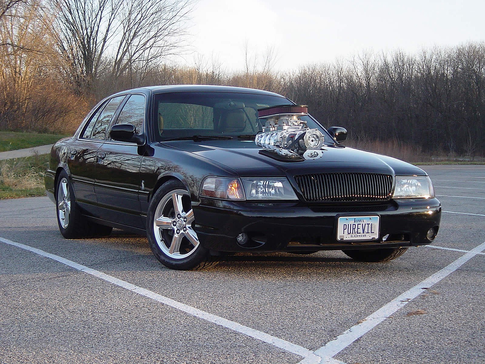 black modified sedan with supercharger