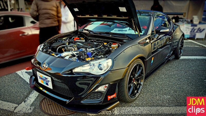 black modified sports car on display