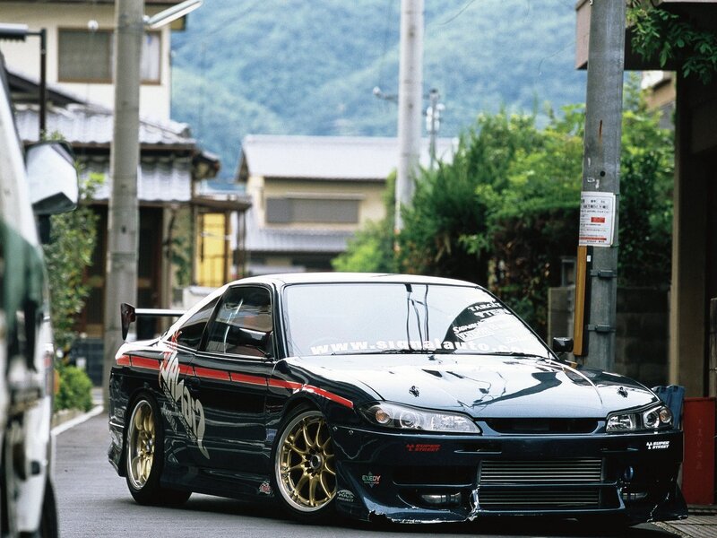 Black modified sports car on street