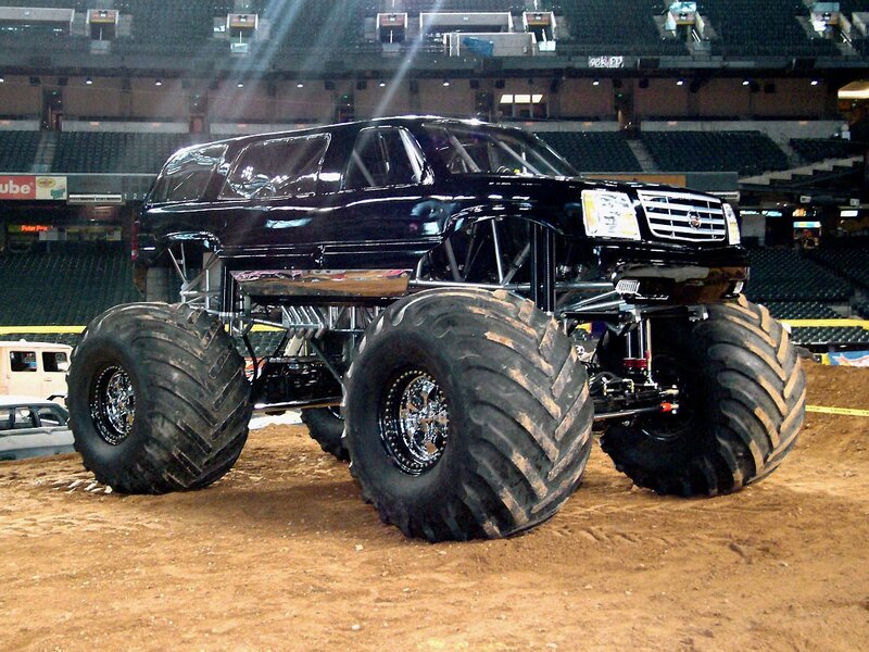 black monster truck in arena