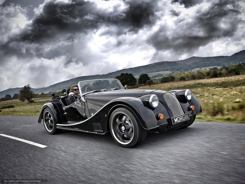 Black Morgan car on country road