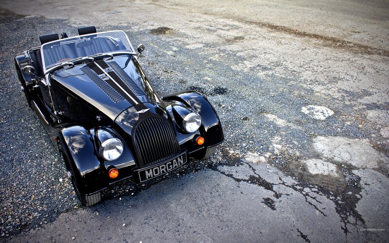 Black Morgan Roadster on gravel